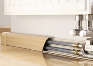 Comment cacher efficacement les tuyaux de chauffage dans un appartement ou une maison privée